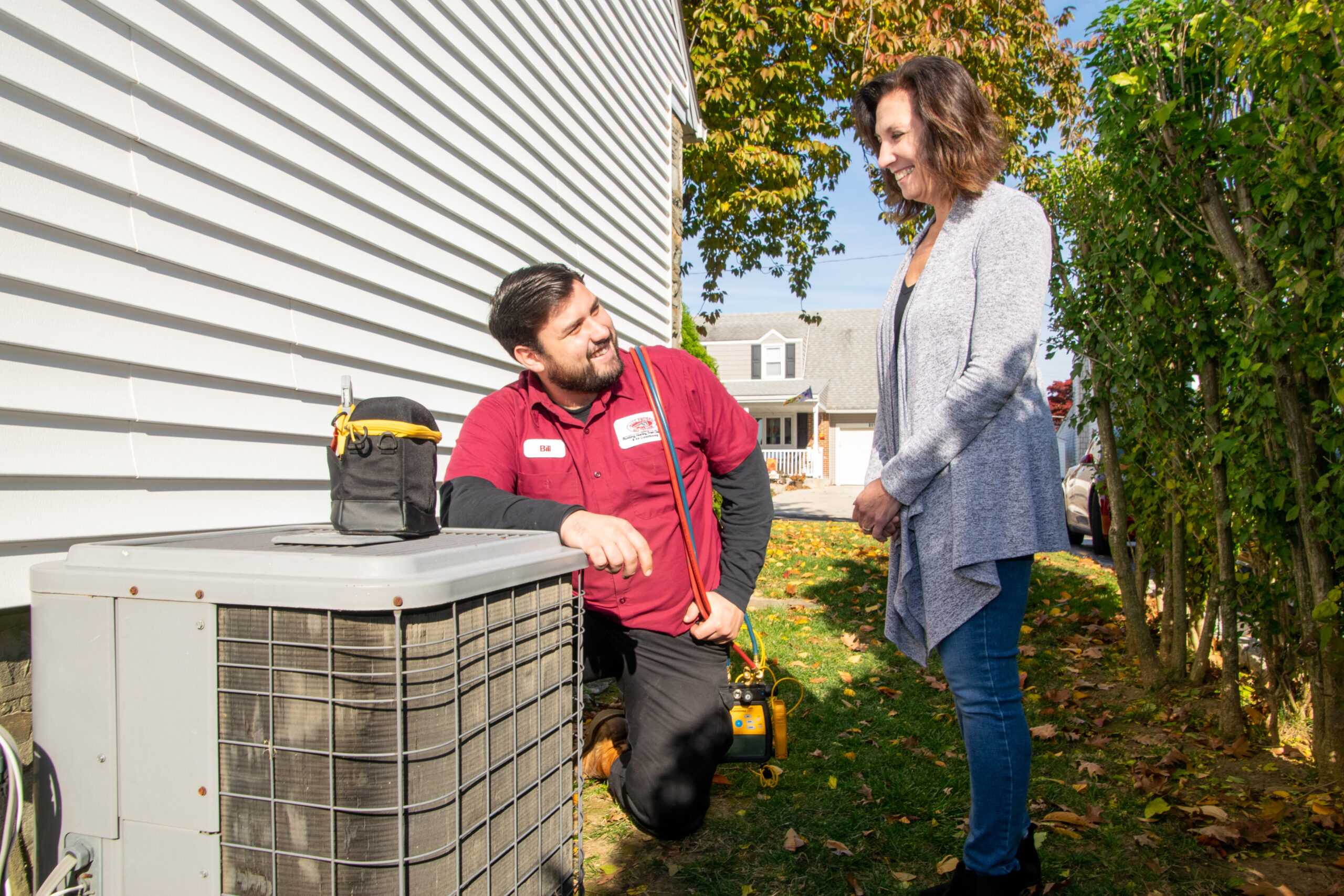Bill Frusco AC technician fixing the AC outside unit. 